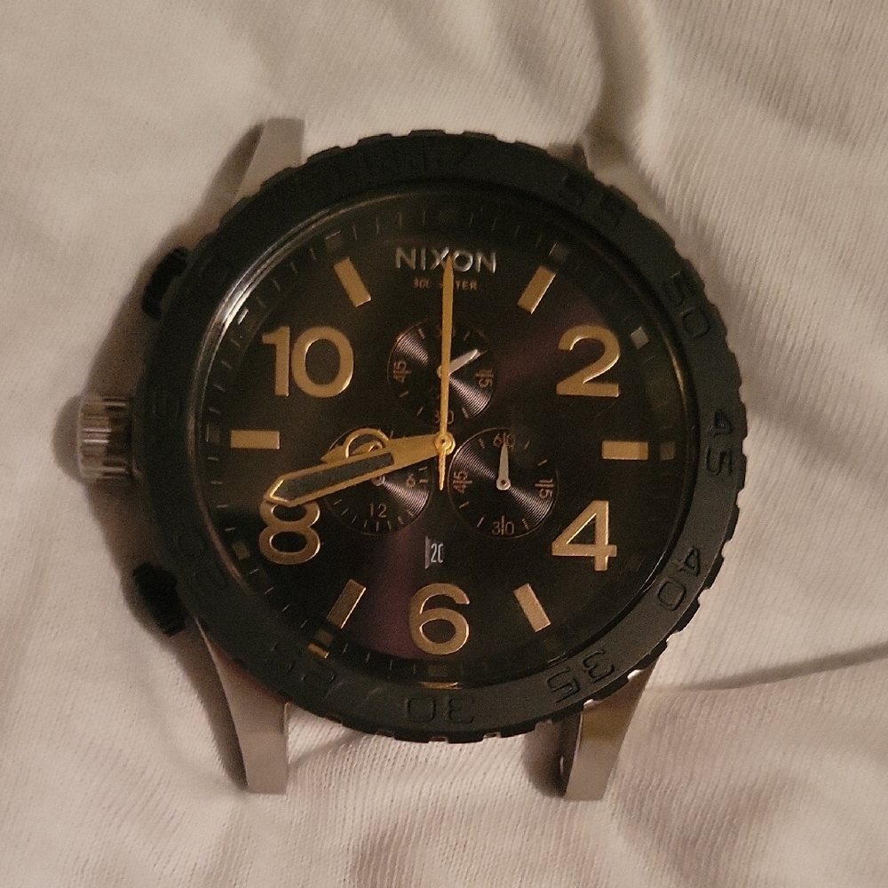 Nixon Black and Gold Watch